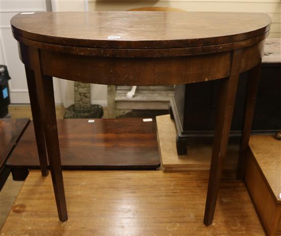 A George III mahogany card table W.95cm